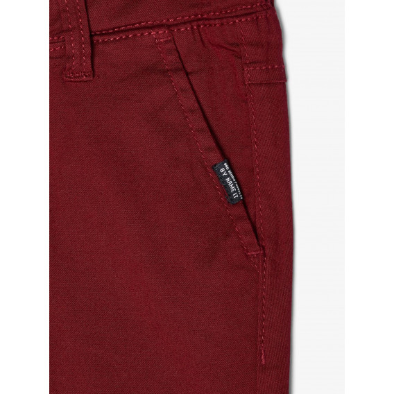 Pantaloni roșii cu un buzunar ascuns pentru băieți Name it 102558 3