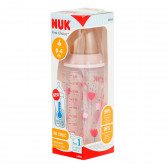 Sticlă de culoare roz din polipropilenă, control Termo cu tetină debit mediu pentru 0-6 luni, 300 ml. NUK 372853 6