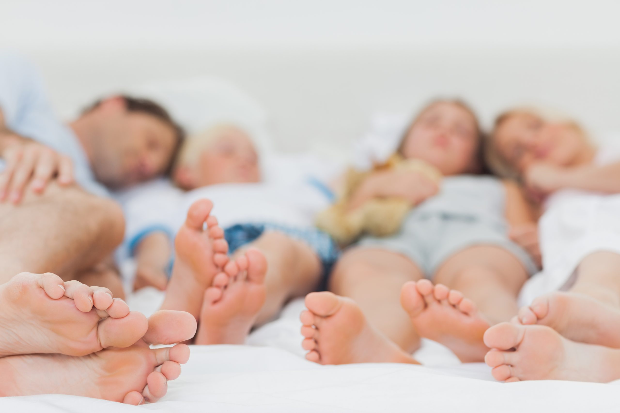 Close,up,of,the,feet,of,a,sleeping,family